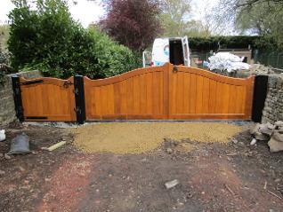 Flood Divert Bow Shape Top Frame Brace and ledge flood gates in Accoya treated with Sikkens Light Oak stain